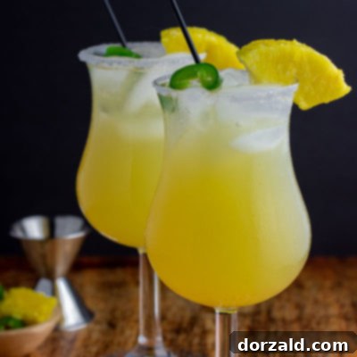 Fiery Sweet Siren 6 two glasses in cocktails with ice pineapple jalapeño