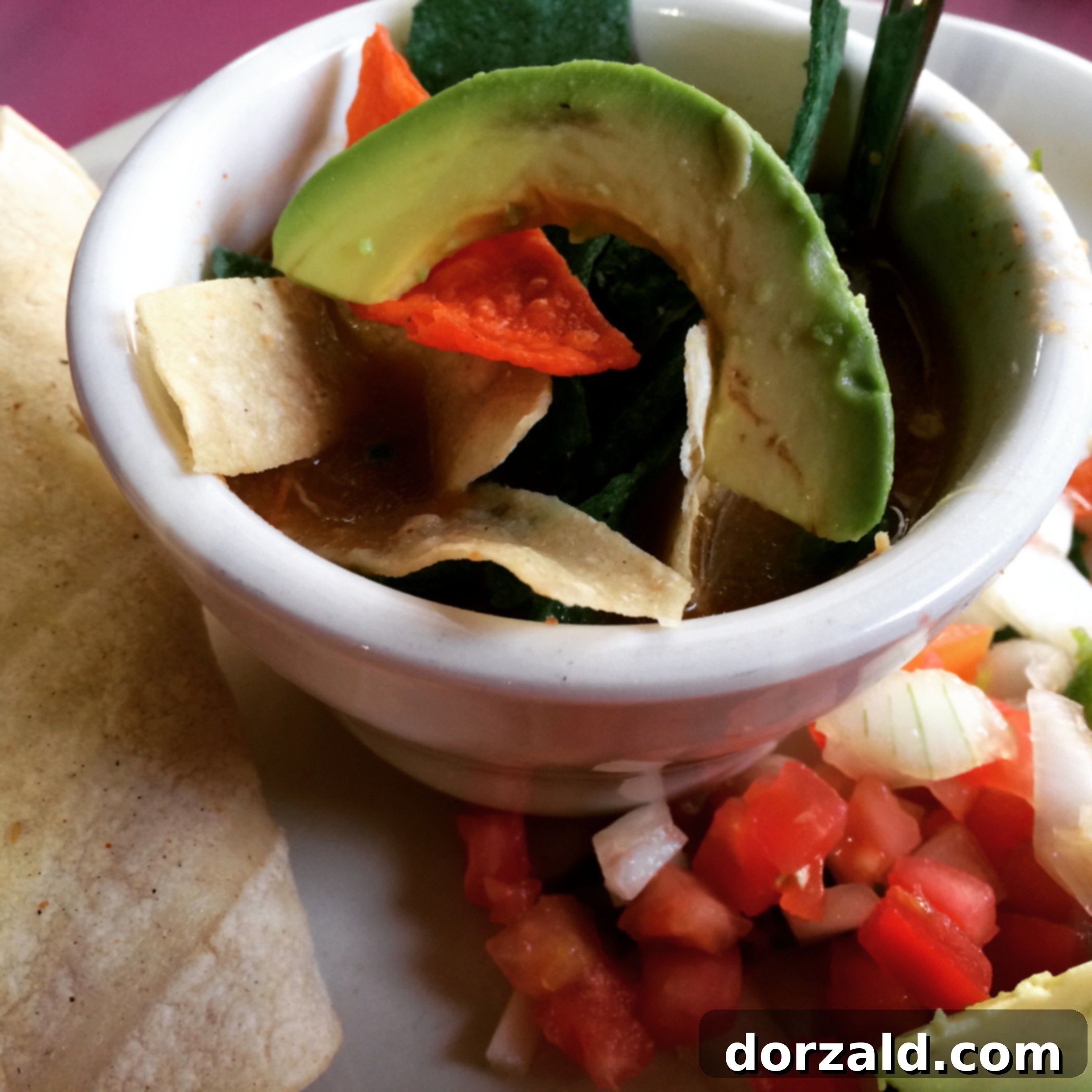 Tortilla soup and chicken fajita taco combo on a table