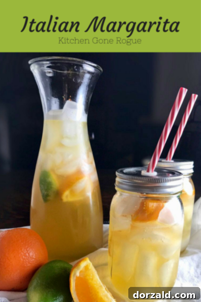 Italian Margarita with fresh citrus slices and a sugar rim.