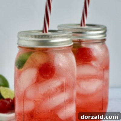 Boozy Shirley Temples made from Boozy Cherry Bomb leftovers, garnished with cherries and lime