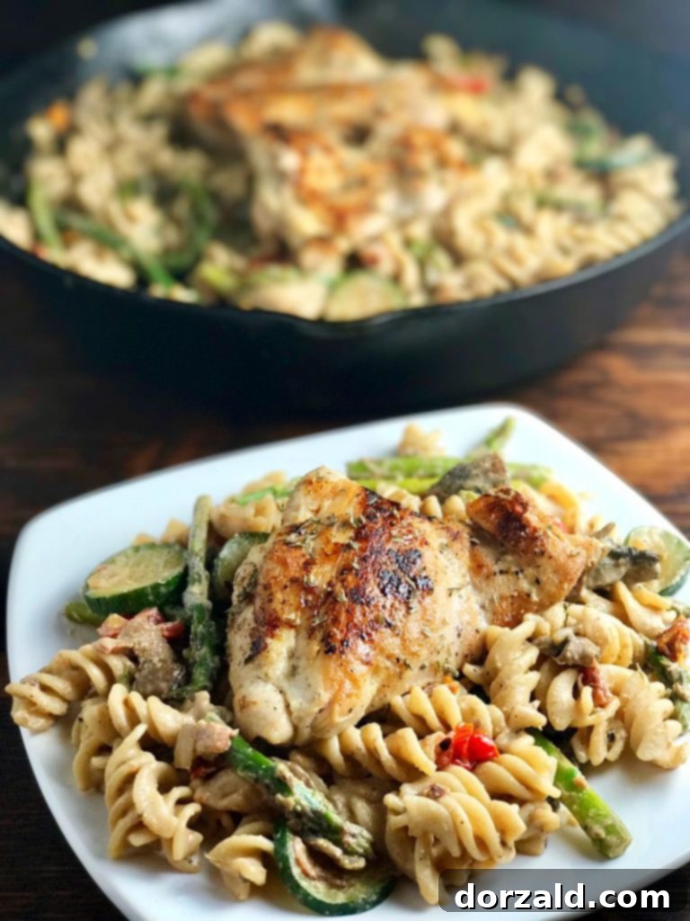 Creamy Goat Cheese Veggie Chicken Pasta, served with fresh herbs