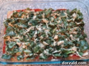 Whisking thickening dairy-free cheese sauce in a pan