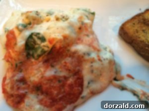 Layer of egg roll wrappers over chicken and spinach mixture