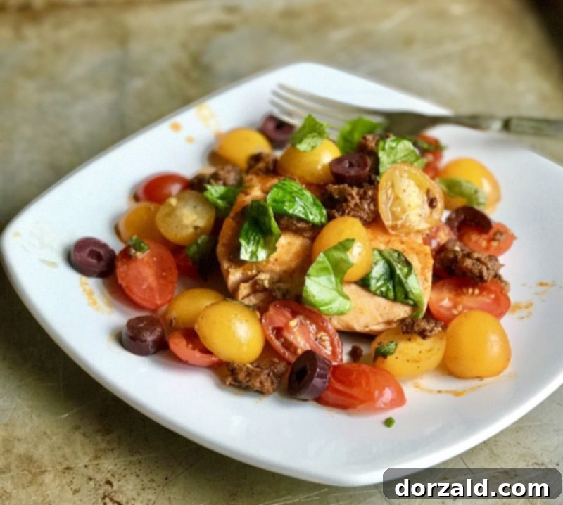 Jamie Oliver-Inspired Tomato Chorizo Salmon dish served on a white plate with fresh basil garnish