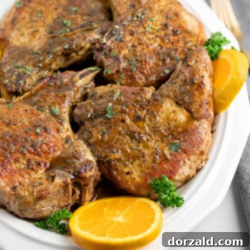 Zesty Cuban Pork Chops 8 Mojo Pork Chops in a skillet