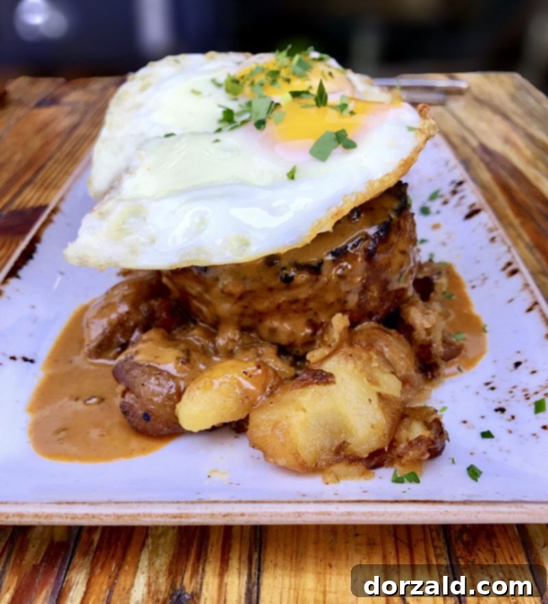 Stock and Barrel Dallas Review 5 Another perspective of the Wood Grilled Wagyu Meatloaf, highlighting its rich textures and presentation.