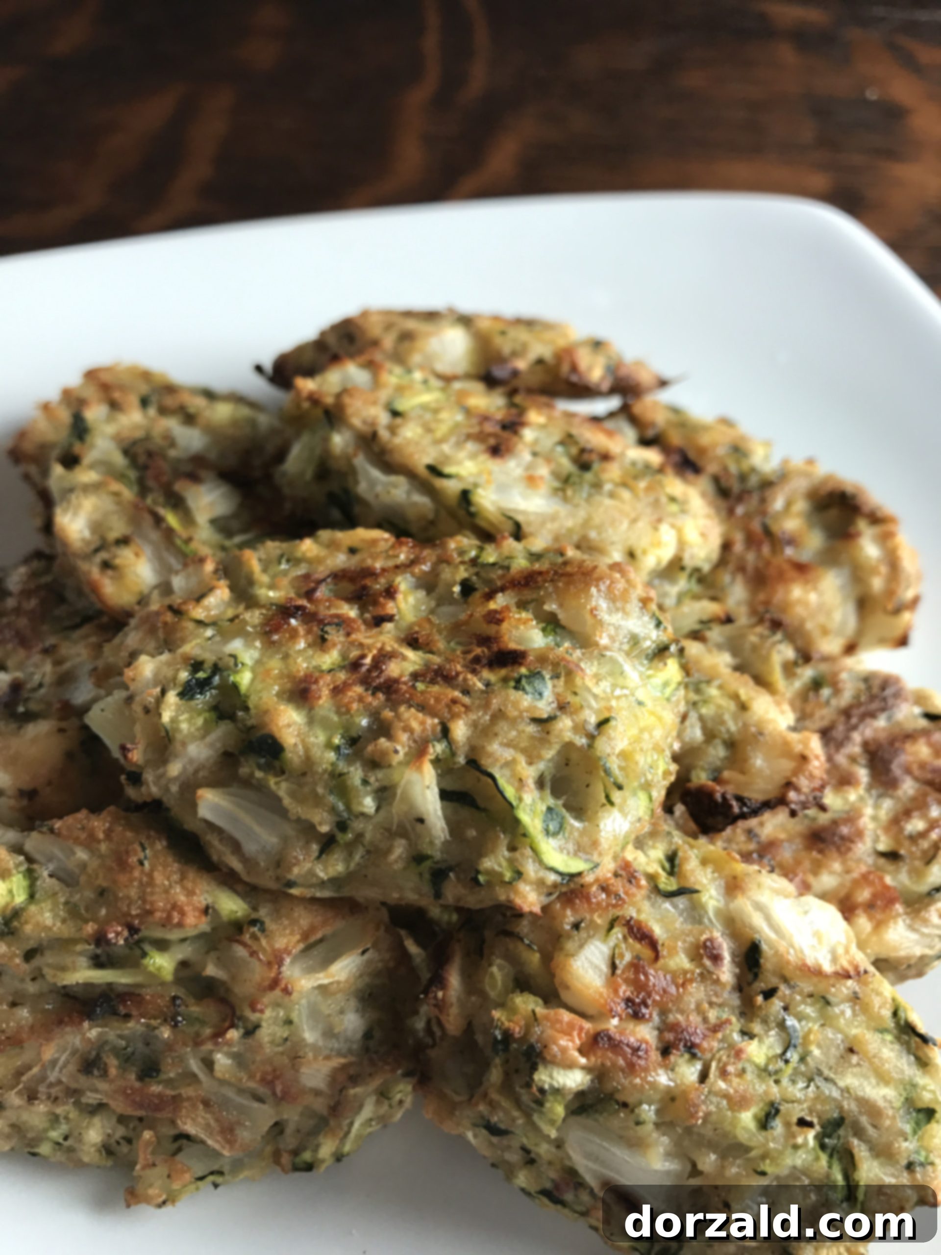 Crispy Zucchini Bites 2 Delicious Zucchini Tots on a baking sheet, ready to be served