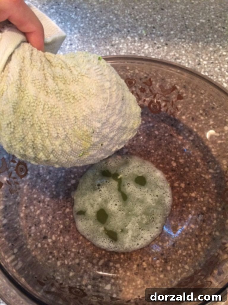 Crispy Zucchini Bites 4 Cooked zucchini tots on a plate with dipping sauce