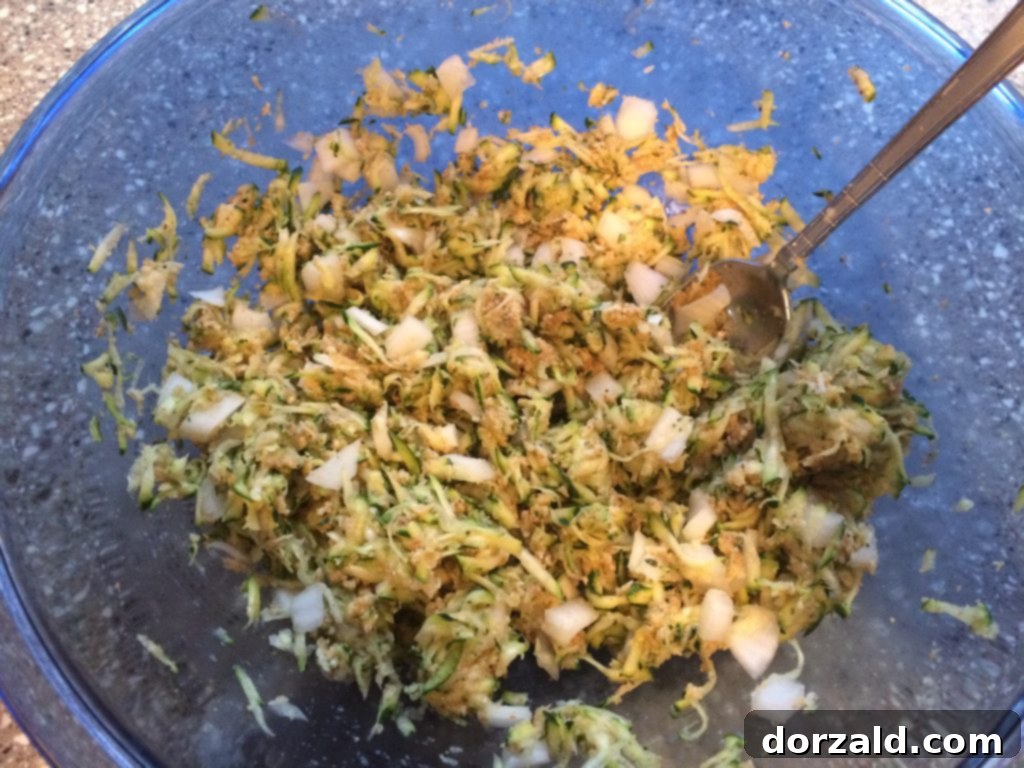 Crispy Zucchini Bites 5 Pile of crispy zucchini tots on a wooden board ready for serving