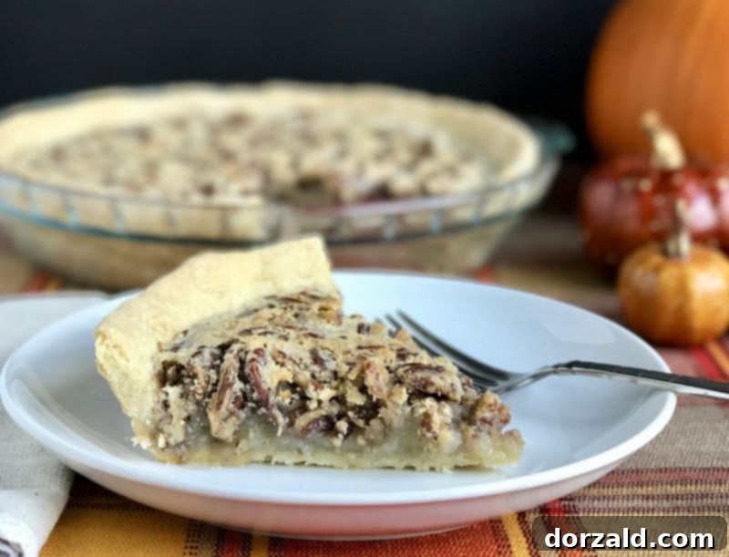 Zesty Dairy-Free Lemon Pecan Pie 3 A close-up of Dairy-Free Lemon Pecan Pie filling with golden pecans.