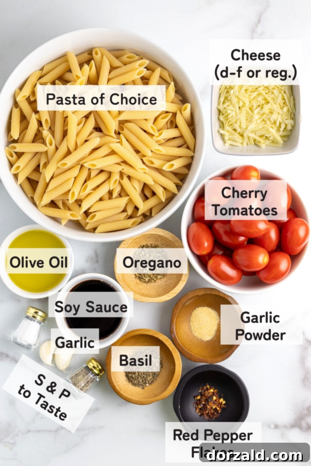 Fresh ingredients laid out: cherry tomatoes, garlic cloves, olive oil, and herbs.