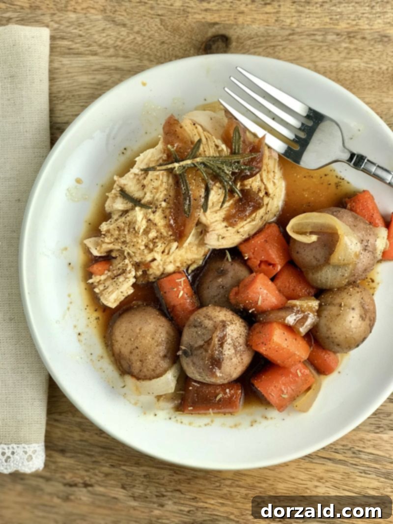 Close-up of Instant Pot Whole Rosemary Chicken and Vegetables on a plate