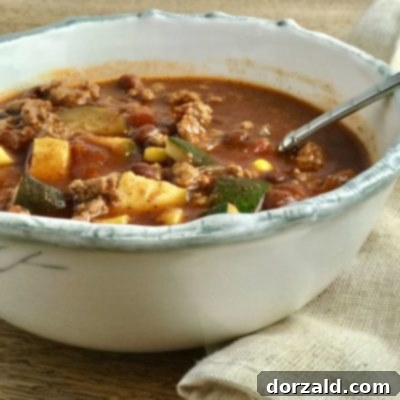 A vibrant bowl of Vegetable Turkey Chili, ready to be served and enjoyed.