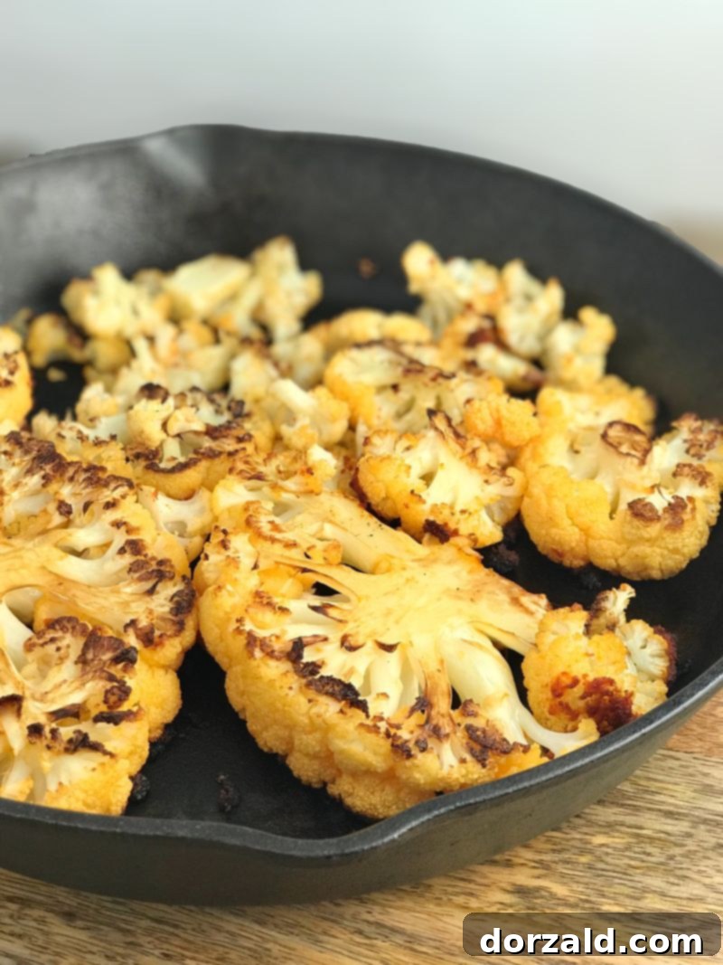 Perfectly roasted Red Thai Cauliflower Steaks, soft inside with slightly charred edges.