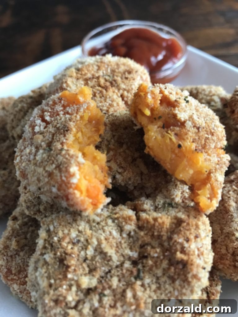 Healthy baked sweet potato tots arranged on a white platter, ready to serve