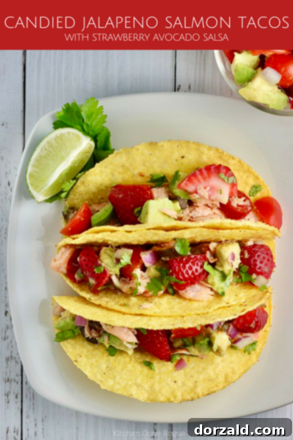 Sweet Heat Salmon Tacos with Strawberry Avocado Salsa 7 Two Candied Jalapeno Salmon Tacos with Strawberry Avocado Salsa, close-up on a wooden board