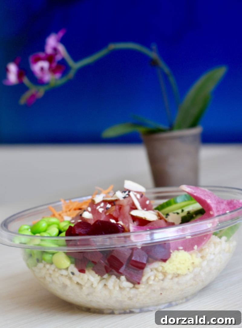 Close-up of a delicious Ponzu Tuna poke bowl at Poke O Mockingbird Station, showcasing fresh ingredients