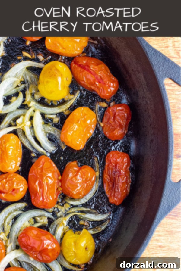 Easy Oven Roasted Cherry Tomatoes with Sliced Onions and Garlic, served in a white bowl, perfect as a beautiful side dish or topping