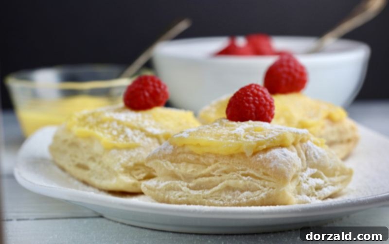 ingredients for dairy-free lemon raspberry puffs, including fresh raspberries and lemon curd