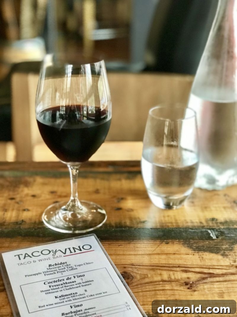 Uncorking Flavors at Taco y Vino 7 Interior view of Taco y Vino with wine bottles