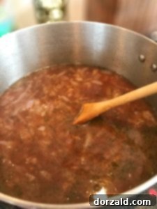 Soup ingredients simmering in a pot
