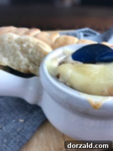 Finished French Onion Soup in an oven-safe bowl with melted cheese