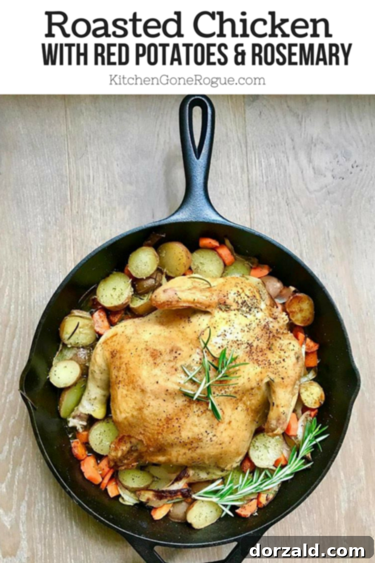 Hearty Roasted Chicken with Red Potatoes, Carrots, and fragrant Rosemary, a perfect Whole30 dinner.