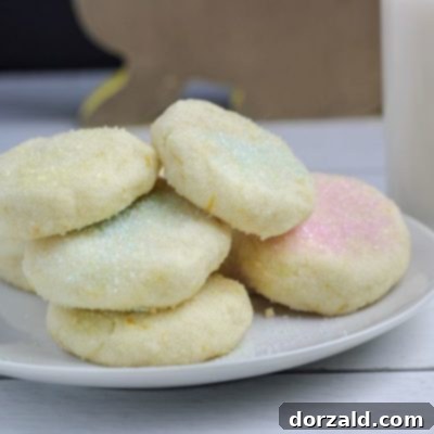 Coconut Lemon Shortbread Cookies on Plate with cup of Almond Milk