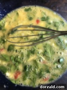 Hearty Grab and Go Egg Veggie Muffins 8 Whisked eggs and mixed vegetables for breakfast muffins