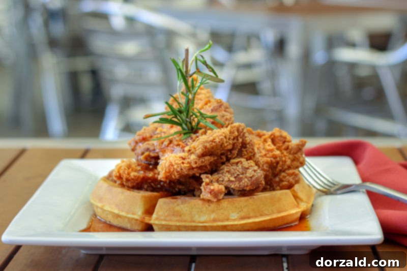 A Review of Fixture Kitchen and Social Lounge 9 Chicken and Waffles with rosemary and chipotle maple syrup at Fixture Fort Worth - Southern comfort food