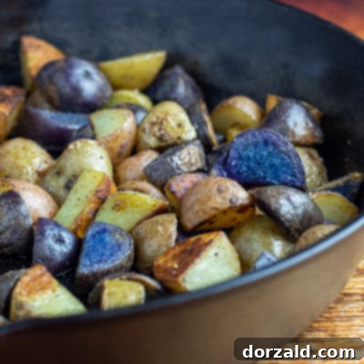 Perfectly roasted baby potatoes recipe, golden and crispy, in a cast iron skillet.