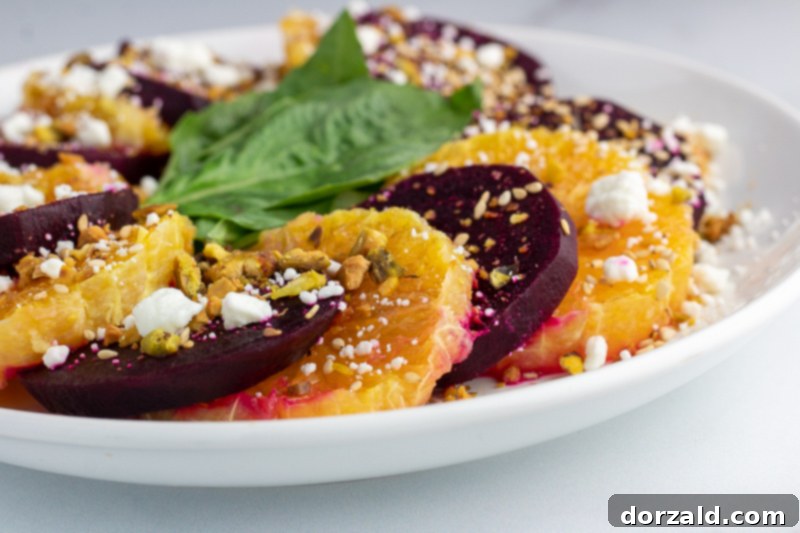 Fresh ingredients for Orange Beet Salad on a wooden board