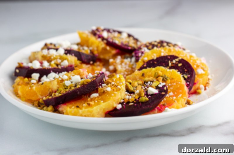 Artistically arranged orange and beet slices on a plate
