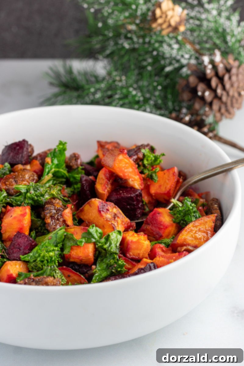 Candied Pecan Kale Salad with Sweet Potato and Beets 3 Close-up of a festive Roasted Sweet Potato, Beet, and Kale Salad with Candied Pecans, perfect for holidays