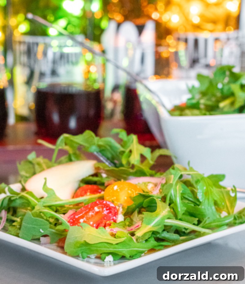 An appetizing spread of food and wine on a table, including a glass of red wine and various dishes, at Checkered Past Winery.