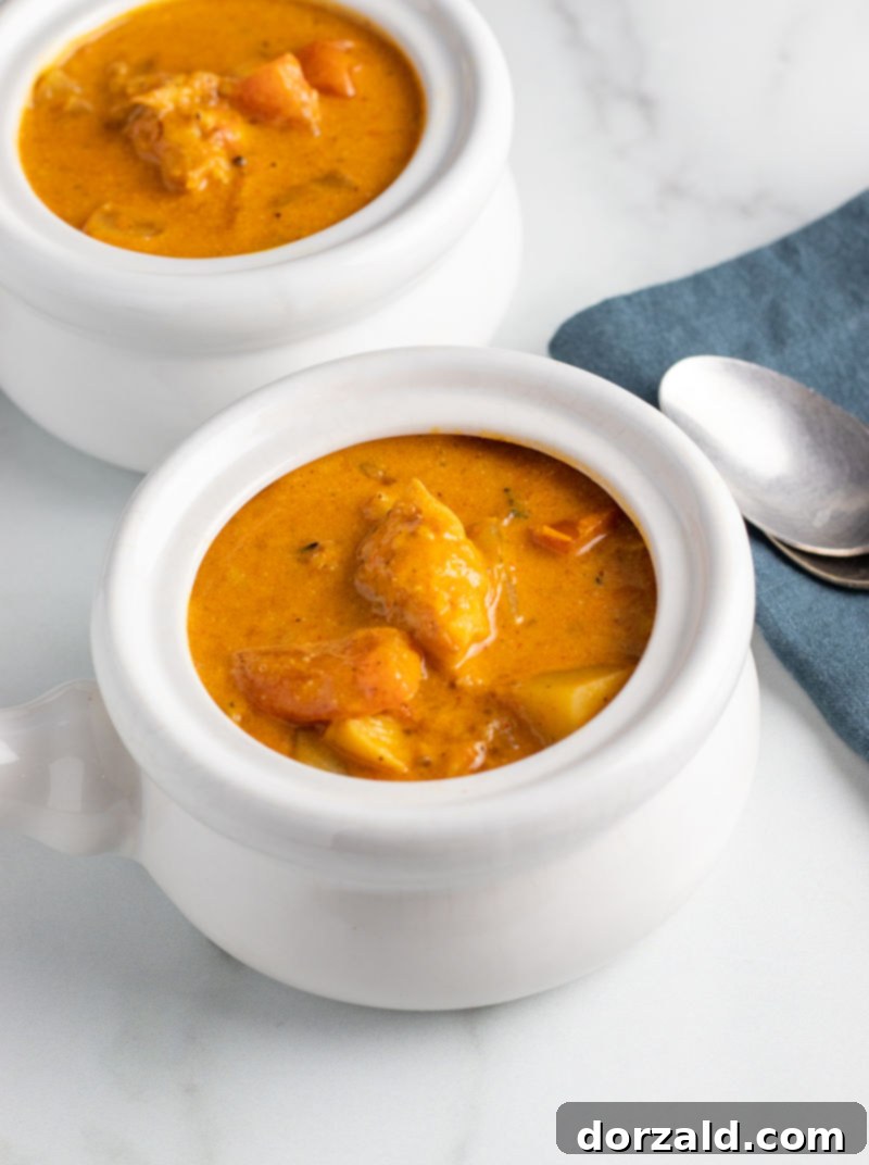 Fresh ingredients for Moqueca Brazilian Fish Stew: bell peppers, onions, tomatoes, and garlic