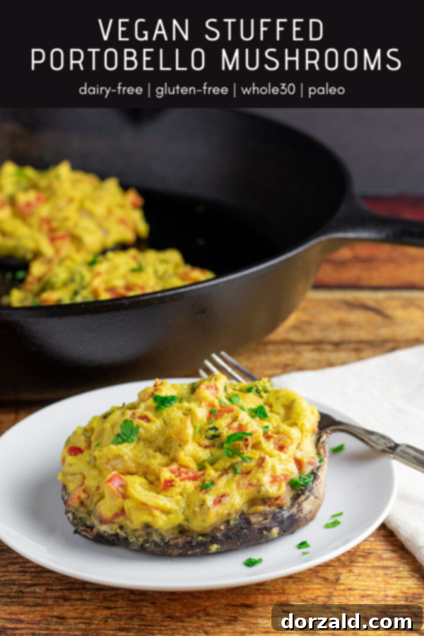 stuffed portobello mushrooms on plate with pan in background
