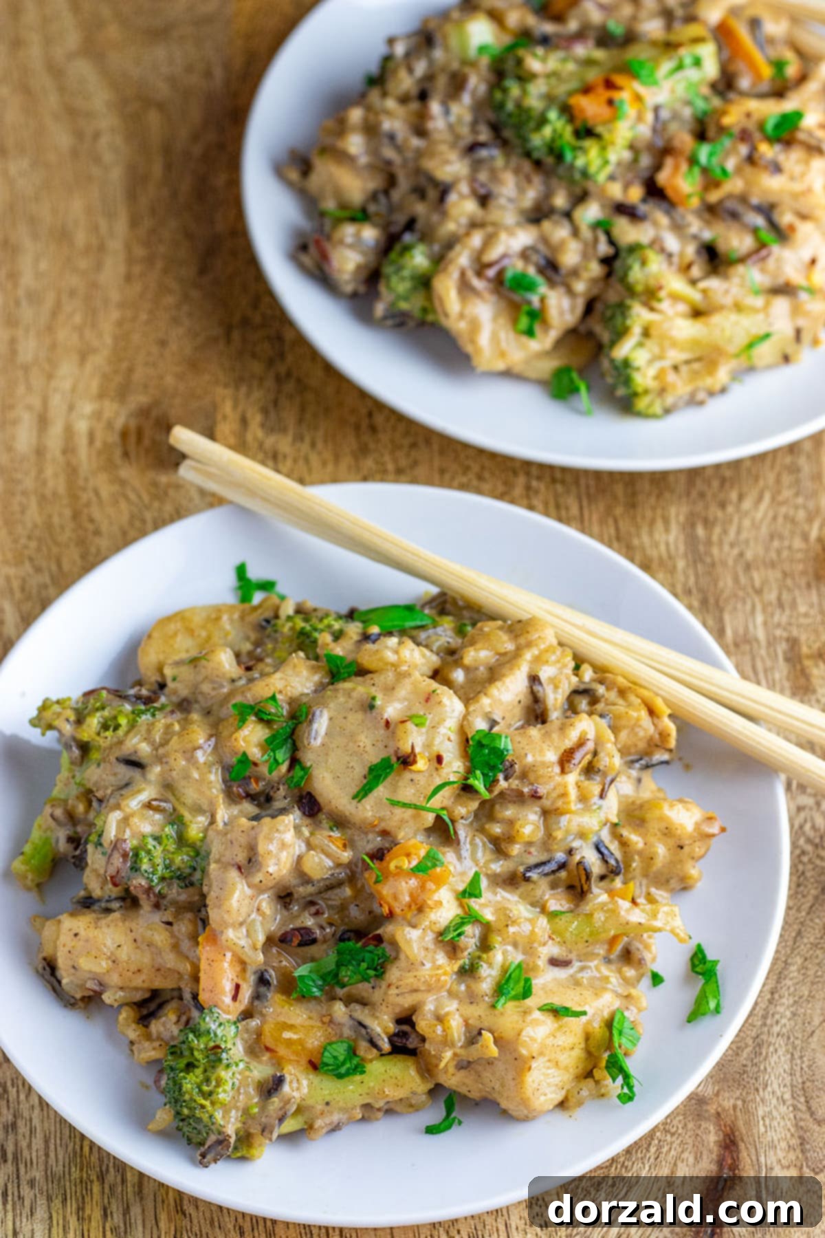 Creamy Almond Butter Coconut Curry Chicken 3 Close-up of creamy curry sauce with chunks of chicken and vegetables.