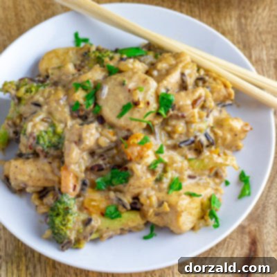 Creamy Almond Butter Coconut Curry Chicken 7 Almond Butter Coconut Curry Chicken on White Plate with Chopsticks - a healthy, dairy-free meal option.