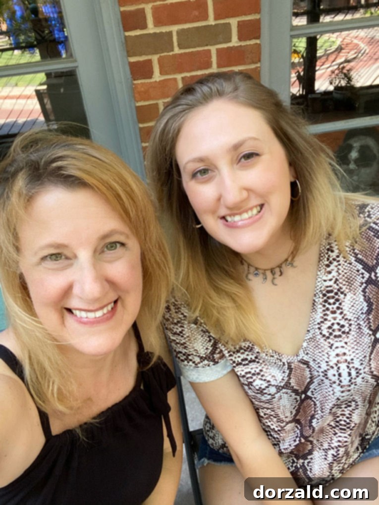 Kelly and daughter enjoying virtual wine tasting at home