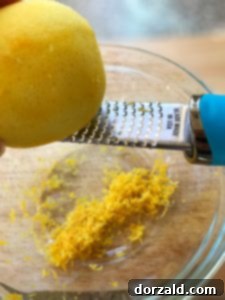 Zesty Vegan Lemon Curd 8 Fresh lemons being zested for the dairy-free lemon curd recipe.