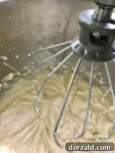 lemon curd filled lemon cupcakes batter being mixed