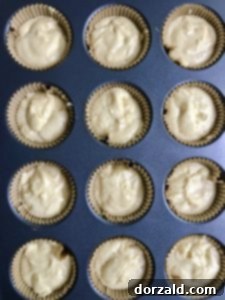 lemon curd filled lemon cupcakes batter in tin