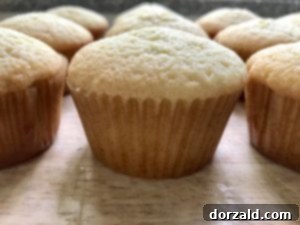 Cooled lemon cupcakes on a rack
