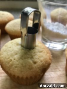 lemon curd filled lemon cupcakes being cored