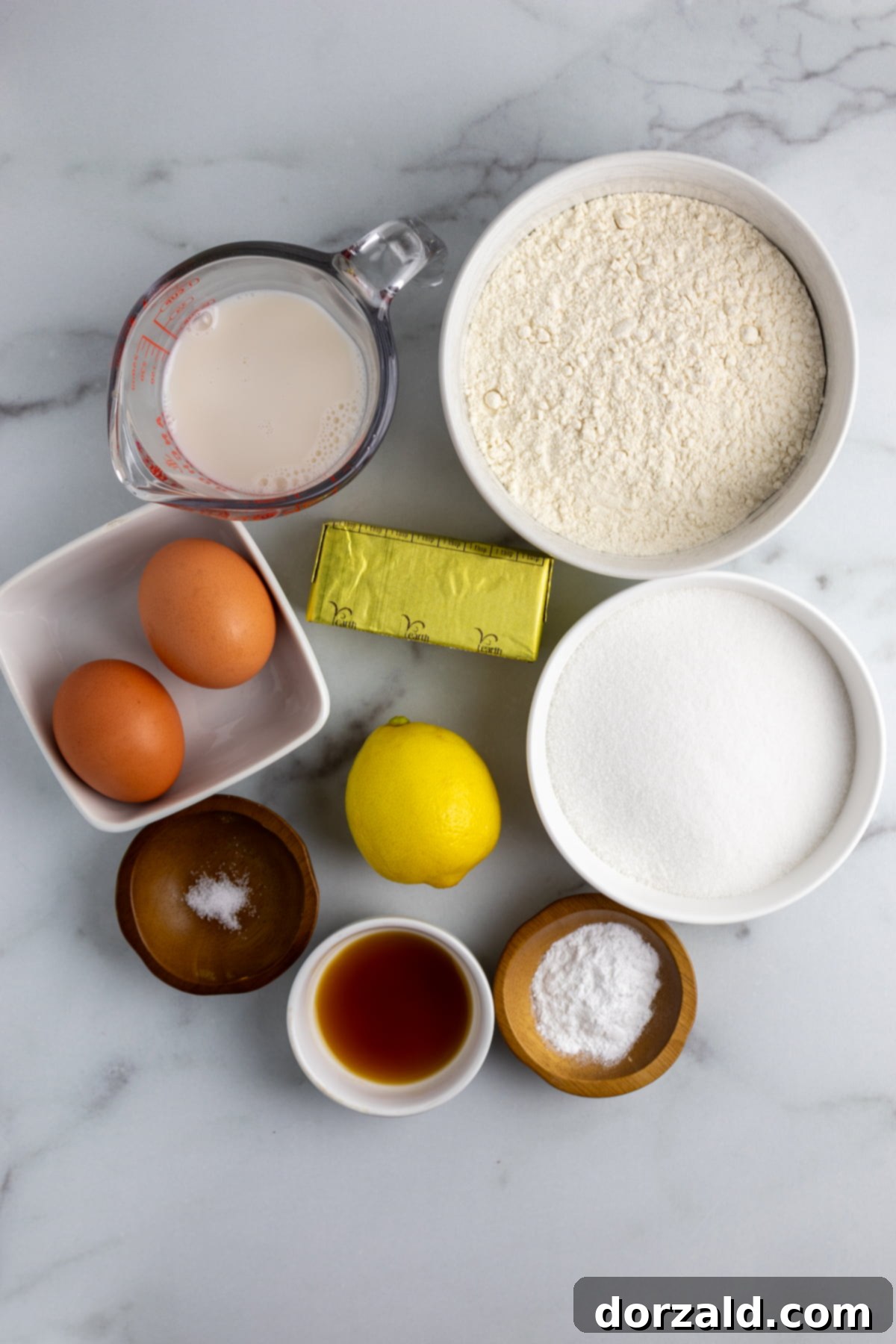 Ingredients for lemon cupcakes laid out on a table