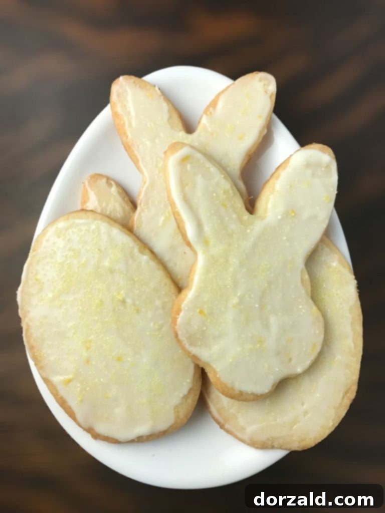 Close-up of baked lemon shortbread sugar cookies on a cooling rack