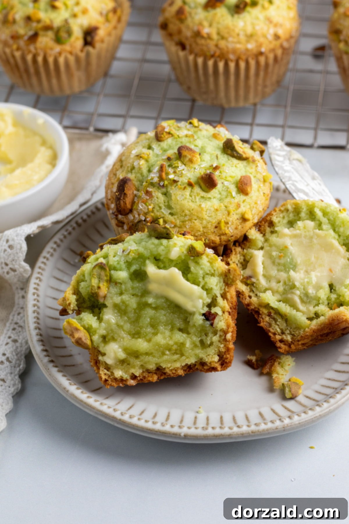 A stack of golden-brown dairy-free pistachio muffins