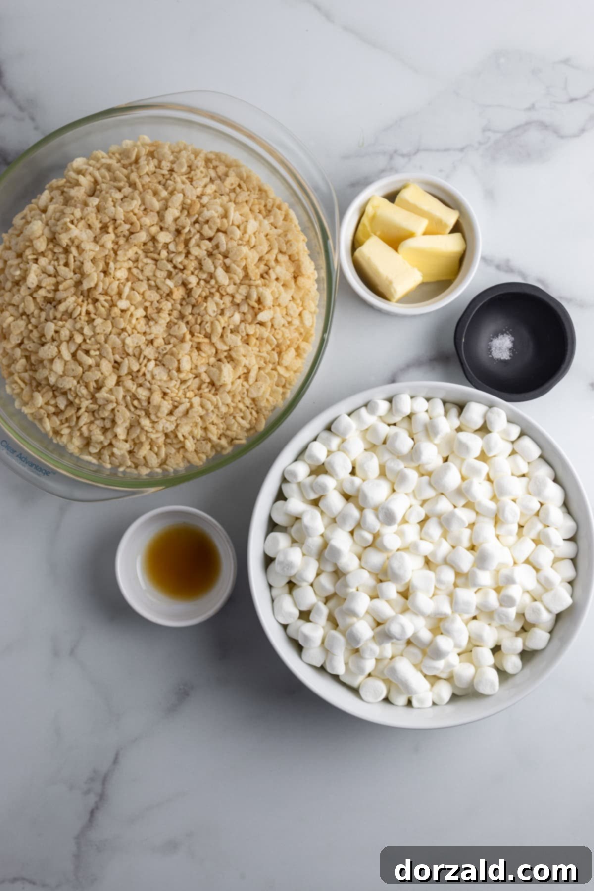 A large pot on a stovetop with dairy-free butter melting, ready for marshmallows.