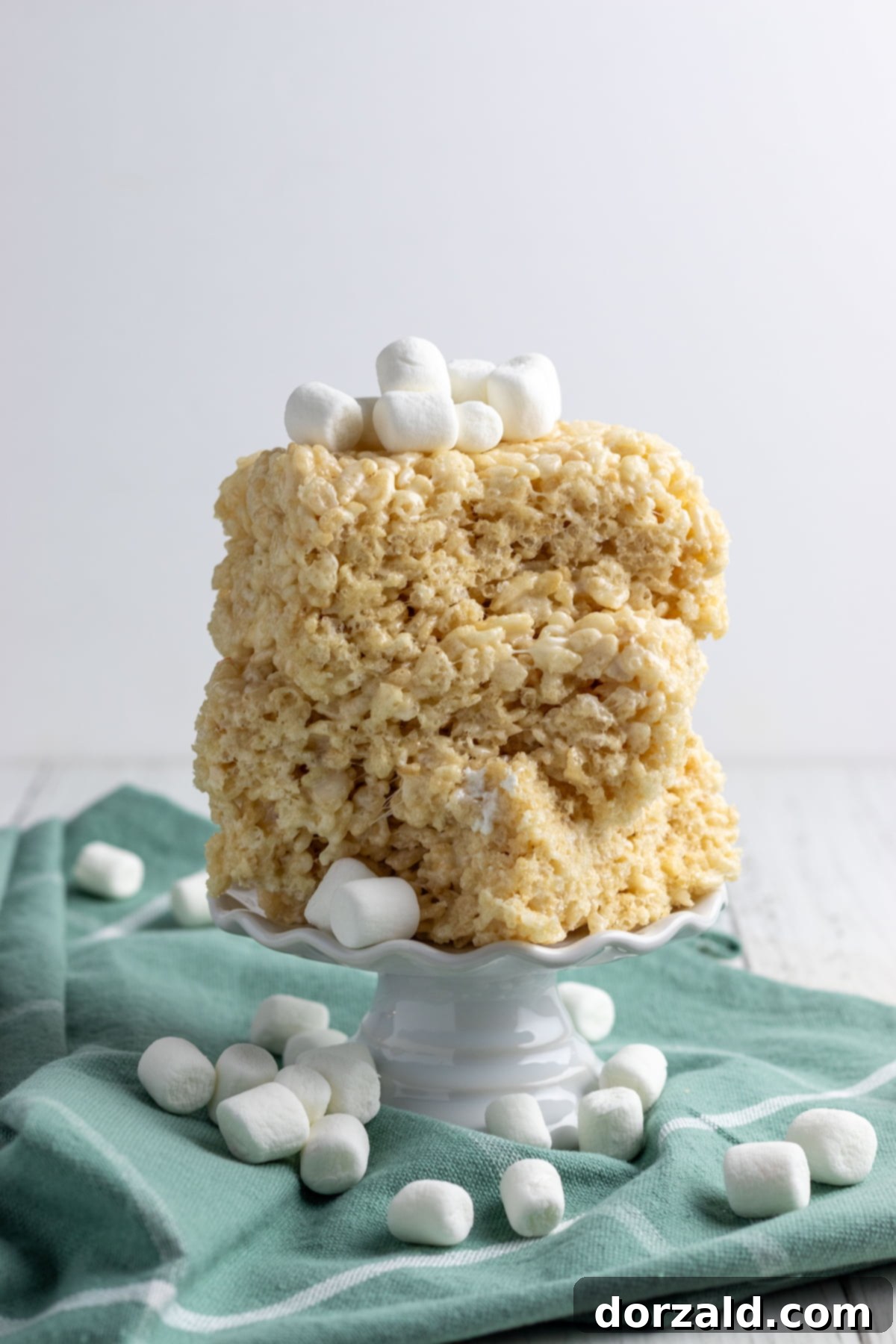 Gooey Dairy-Free Crispy Bites 8 A stack of Dairy-Free Rice Krispie Treats with festive sprinkles